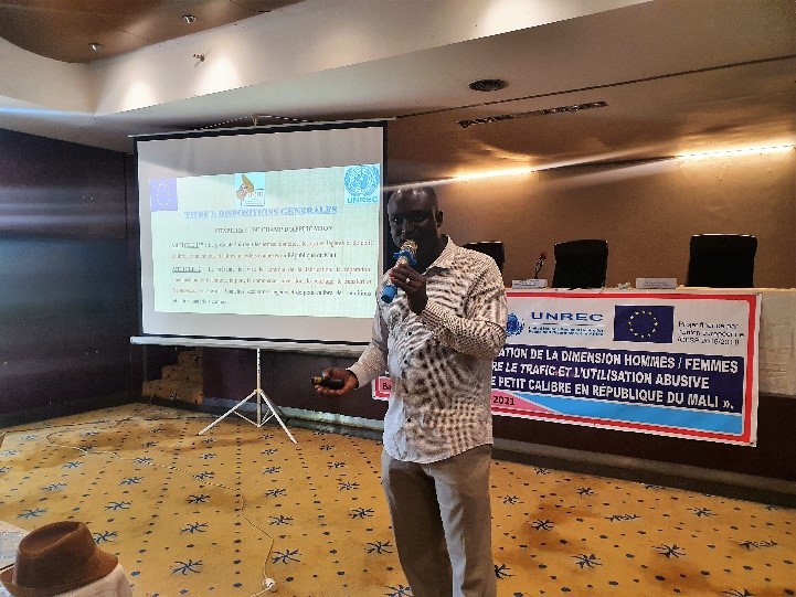 A person holding a camera in front of a screen

Description automatically generated with low confidence