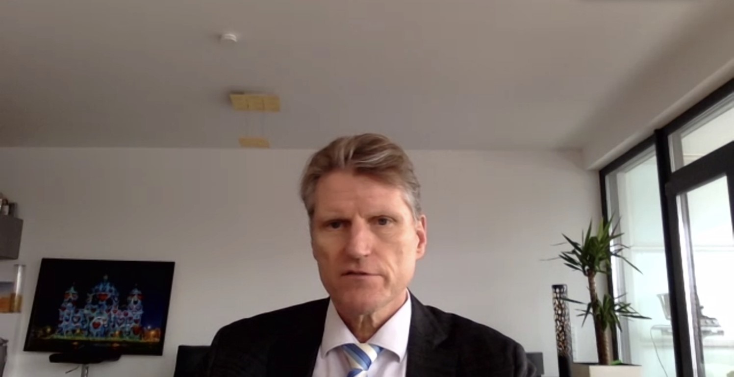 A person in a suit

Description automatically generated with medium confidence